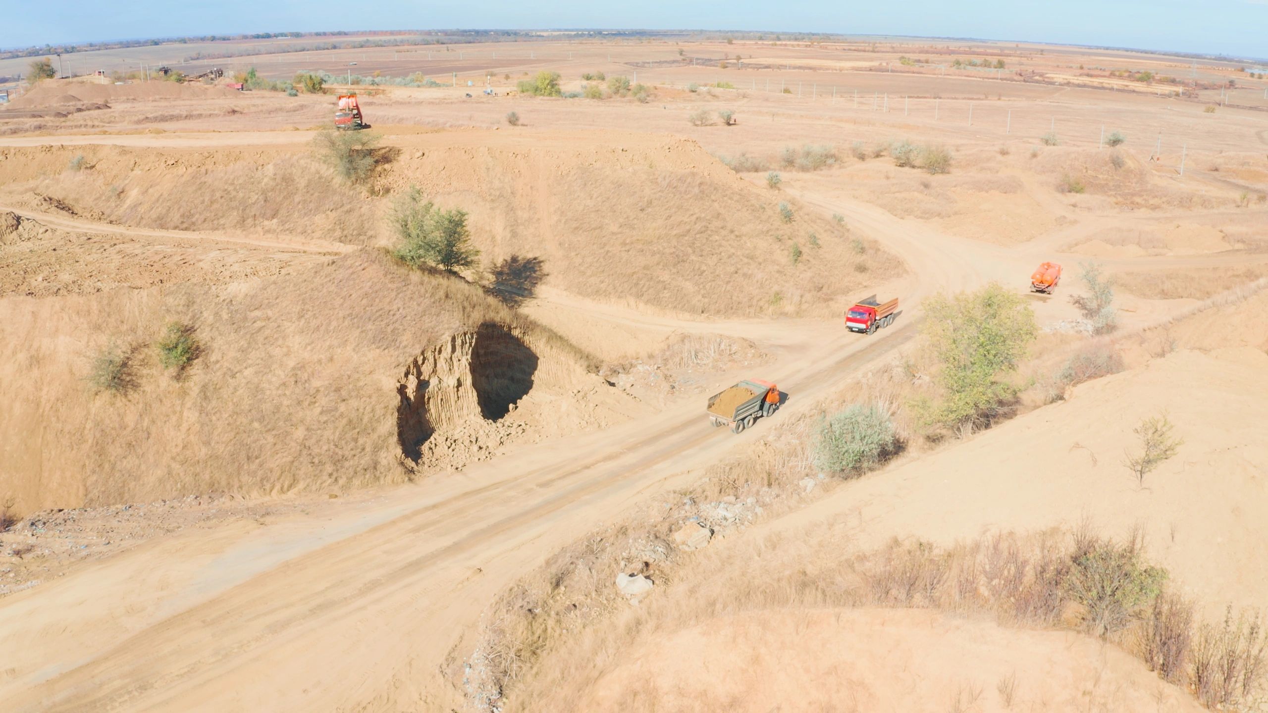 Dump trucks transporting material in a quarry
