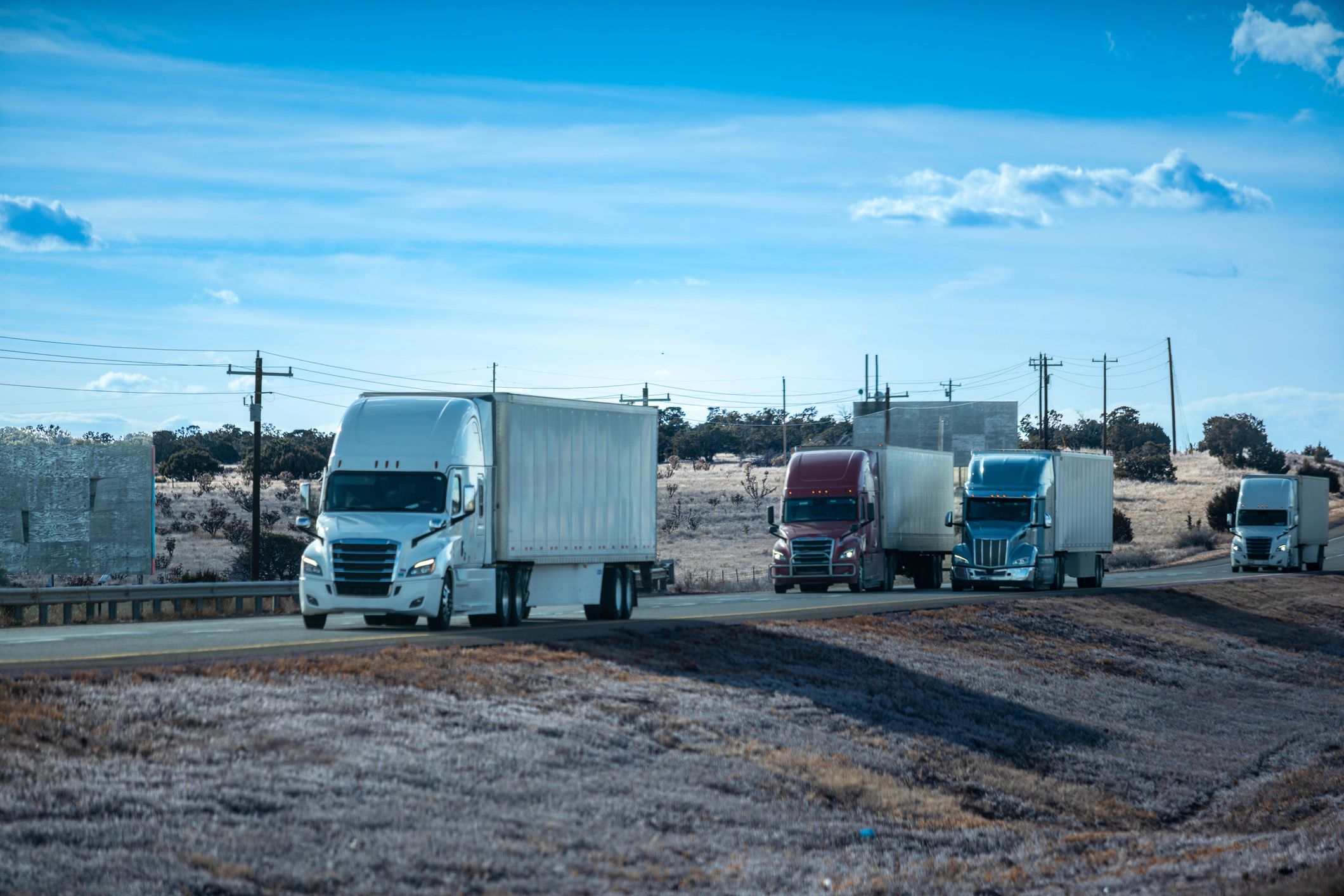 Line of commercial trucks representing a dependable fleet