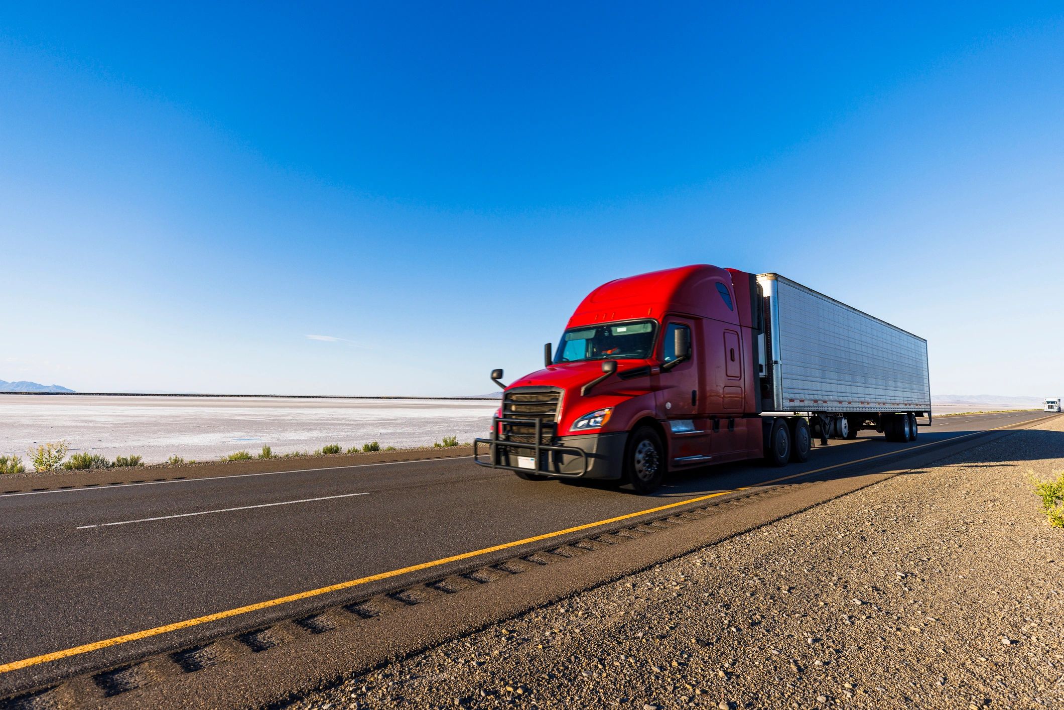 Semi truck hauling cargo on open road